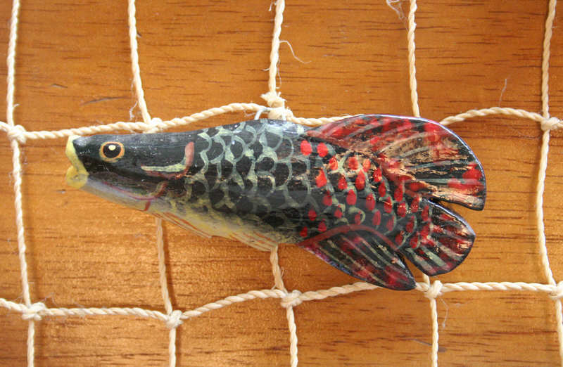 [Image of carved fish]