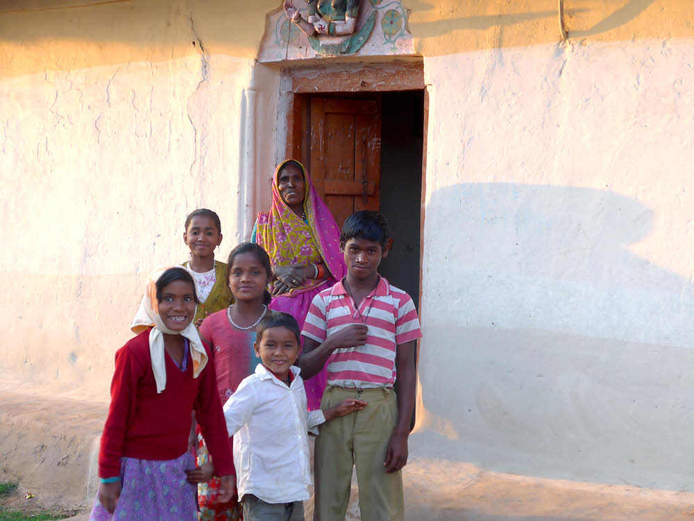 Family in doorway... girl at back left eyes opened